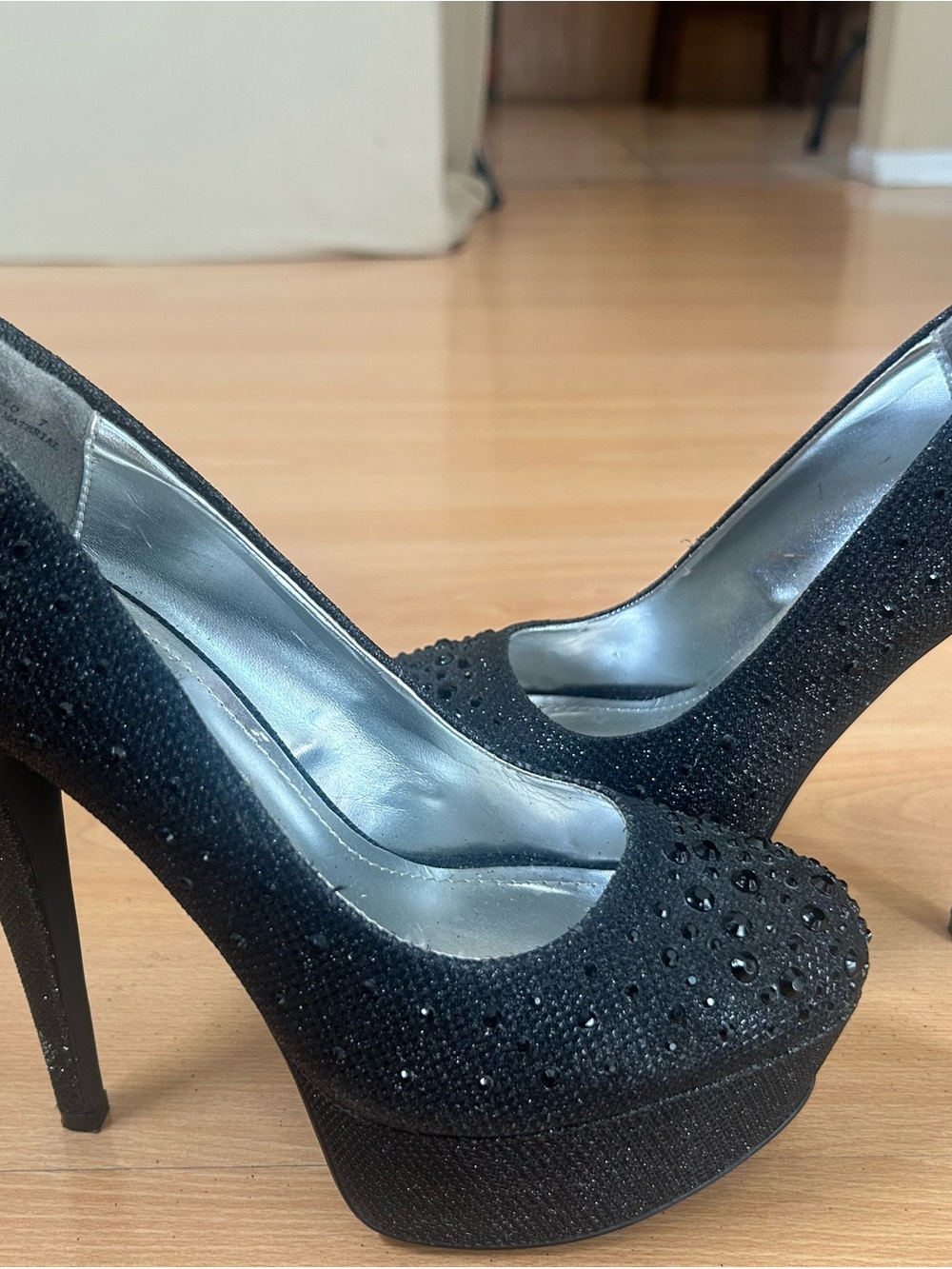 6.5 black stiletto featuring a glittery finish rhinestone studded platform